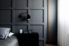 03 a graphite grey molded statement wall accentuates the bed instead of a headboard