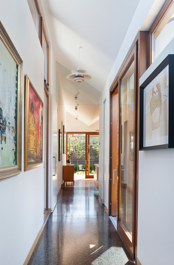 artwork display in hallway The owners wanted their artwork collection to be displayed, and they were hung in the corridors