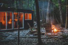 cabin with a fire pit outside