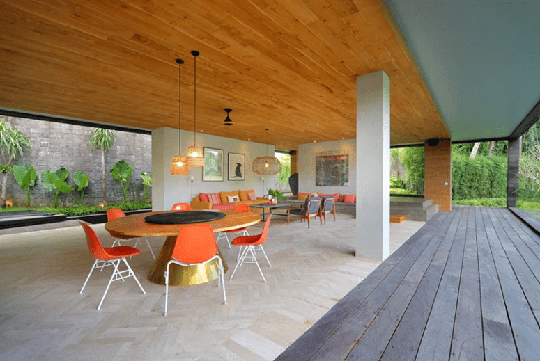 The living room and dining zones are also here, they can be opened to the deck, too, and feature modernist furniture The living room and dining zones are also here, they can be opened to the deck, too, and feature modernist furniture