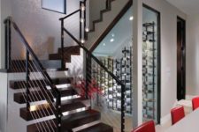 05 a modern small wine cellar under the stairs with wall-mounted metal shelves