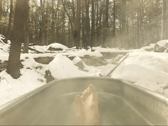 an outdoor hot tub for relaxation A hot tub is also present to feel full relaxation in a snowy forest