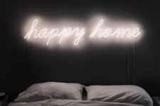 06 illuminate your bed with a neon light sig instead of a headboard to make it more welcoming