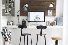 07 a built-in wall-mounted desk with high stools to sit or stand whenever you want