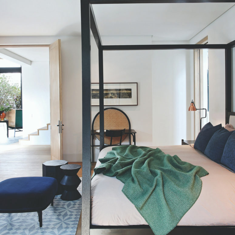 stylish guest bedroom design The guest bedroom is done with a framed bed and some chic furniture, doors let open it to the rest of the house