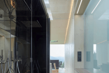 08 The minimalist shower is hidden behind opaque glass, which brings natural light in