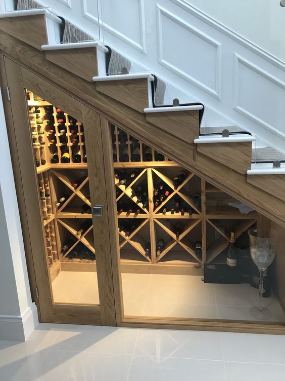 https://www.digsdigs.com/photos/2018/07/08-a-small-wine-cellar-with-glass-doors-and-wooden-shelves-for-storage-doesnt-require-much-space.jpg