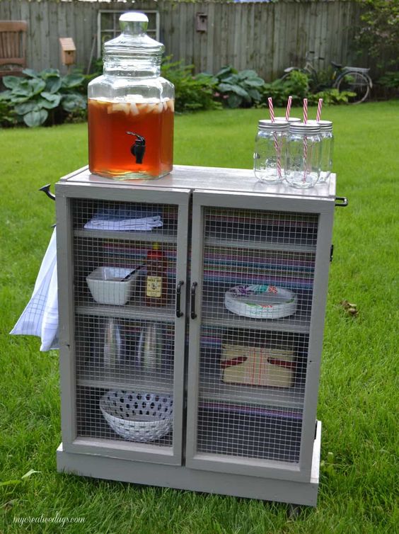 a vintage-inspired beverage unit in grey with mesh doors out of IKEA Malm dressers wows