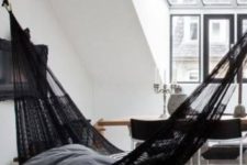 09 a Scandinavian space with a matching black hammock that seamlessly fits the space thanks to its design