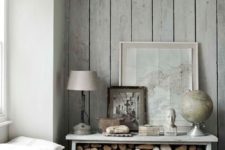 09 whitewashed greyish wood planks bring a coastal feel to the space and look very natural