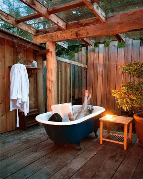 a whole outdoor pavilion built for placing a bathtub and some potted plants will keep your privacy safe