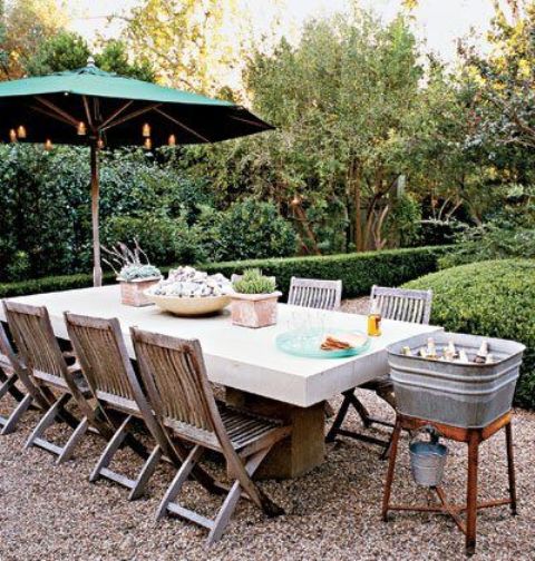 a modern and sleek white dining table and folding wooden chairs for a bold contrast