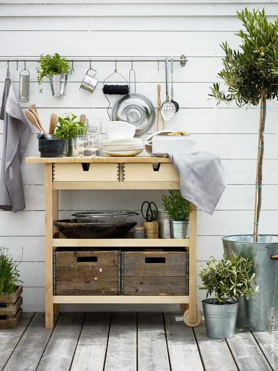 a natural looking outdoor bar of an IKEA Forhoja cart is a great idea for any Scandinavian space
