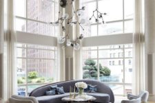 16 a couple of floor to ceiling windows fill the space with light and helps to highlight the double height of the ceiling