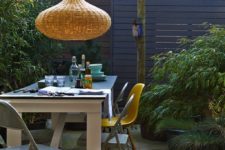16 a modern dining space is made cooler and cozier with a catchy wicker lampshade