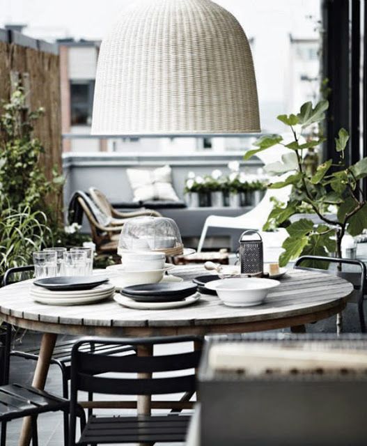 a Scandinavian dining space can be spruced up with a white wicker lampshade