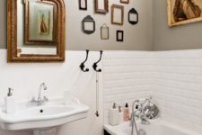 17 a vintage bathroom done right with an exquisite artwork and some small empty frames
