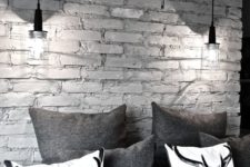 18 a monochromatic space with a grey brick wall that makes it more interesting