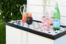 19 this chic outdoor bar with a mosaic on top is made using IKEA Josef cabinets and looks super chic