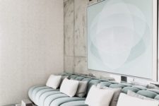 20 a contemporary TV or cinema room with a luxurious aqua velvet banquette