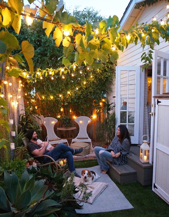 a living wall of hanging greenery and some lights make the space super inviting