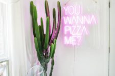 21 make your dining space fun and whimsical with a large cactus in a planter and a neon light sign for a wow look