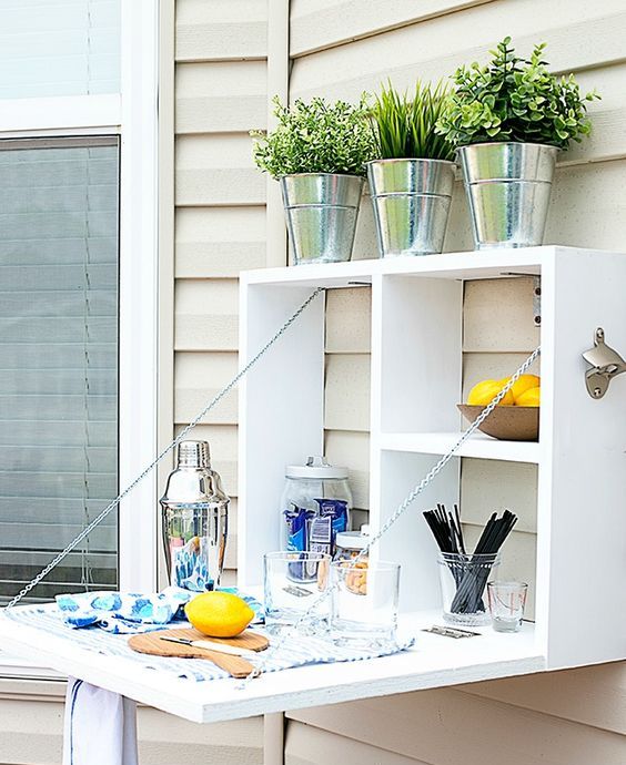 a folding outdoor bar provides enough storage and bar counter space
