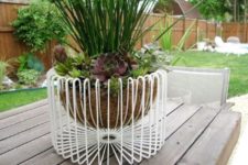 24 a wire basket fruit bowl by IKEA turned an outdoor planter is a bold modenr idea to try