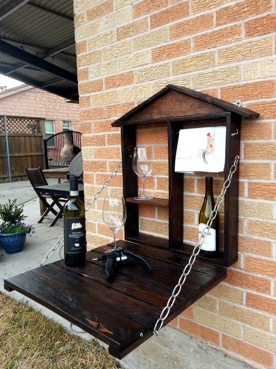 a small dark-stained wooden pallet bar attached to the wall is all you need