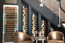 26 wine bottles on wall-mounted shelves and a special cooler plus a sitting space to have a drink here
