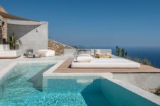 01 This gorgeous holiday home is located on Santorini and is inspired by the local cave houses