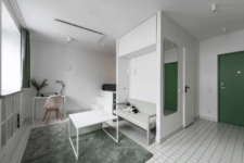 01 This tiny minimalist apartment features everything necessary for living and is done with old touches of green