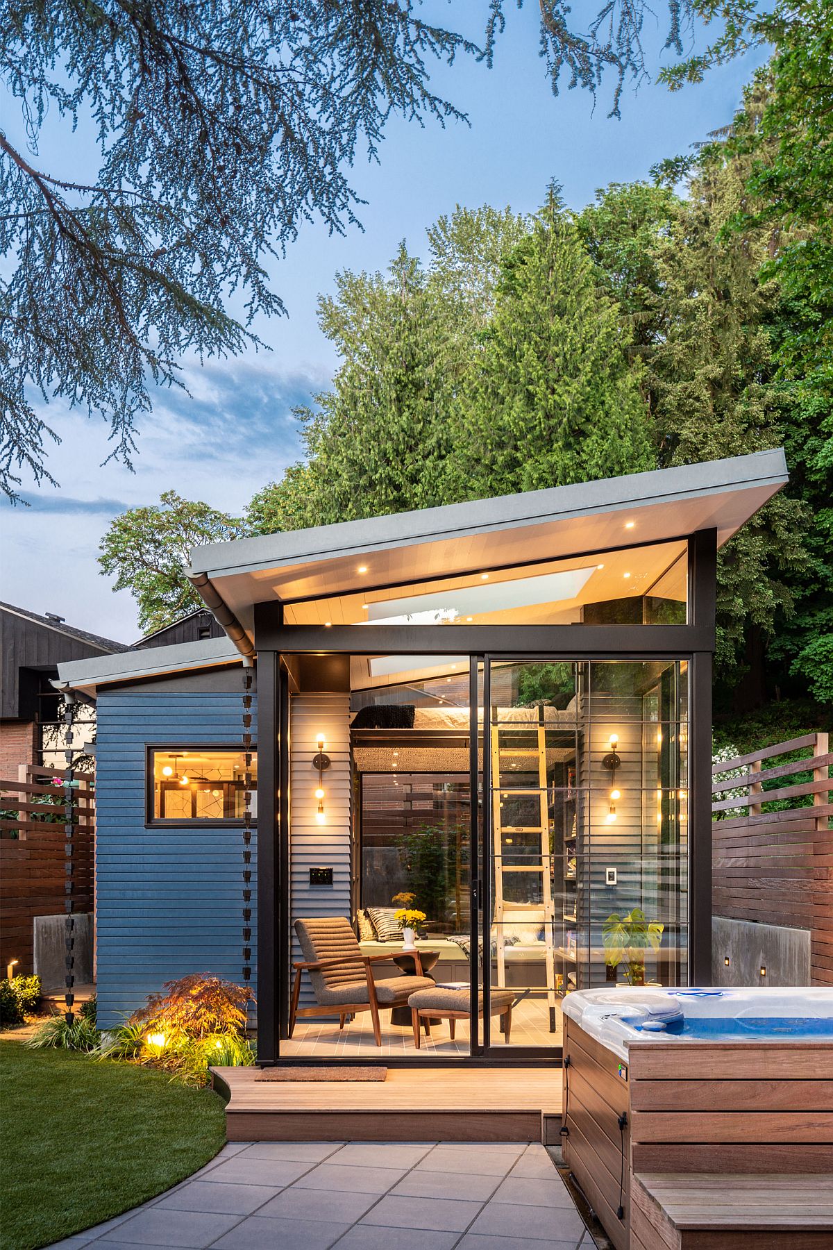 This ultra modern backyard shed has a small footprint yet several functions and zones inside, much light and storage