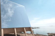 02 The energy is generated with these large solar panles, and the cabin itself is made of light-colored wood