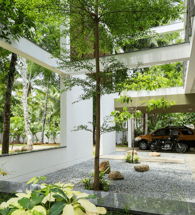 The house features contemporary architecture and decor and a series of garden openings with real greenery and living walls The house features contemporary architecture and decor and a series of garden openings with real greenery and living walls