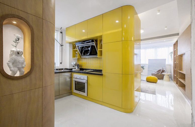 yellow modern kitchen The main box is a bold yellow one, which contains kitchen cabinets and some built-in appliances