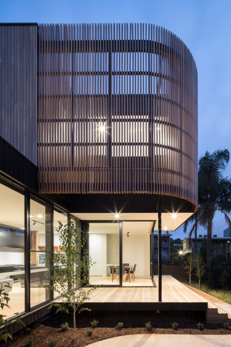 The upper part is clad with wooden planks in a curvy way to give it a more modern look and avoid excessive sunlight The upper part is clad with wooden planks in a curvy way to give it a more modern look and avoid excessive sunlight