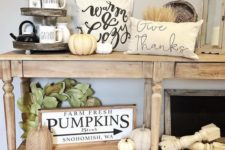 02 a neutral fall console table with white natural and faux pumpkins, wheat, leaves and printed pillows