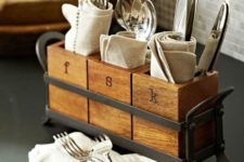 02 an industrial kitchen caddy with cutlery holders of wood and a metal frame in grey
