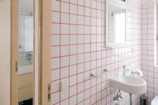 02 bright pink grout and white tiles for a modern and bold look in your bathroom