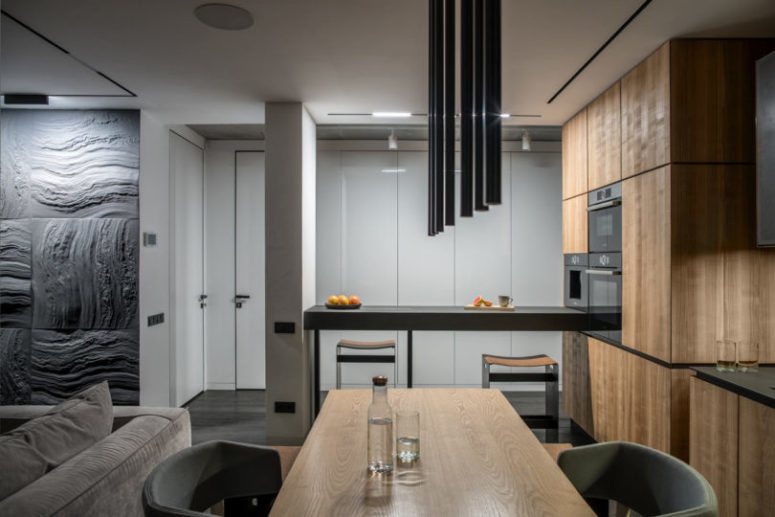 There's also a bar counter, which can be used as a kitchen island and a breakfast nook