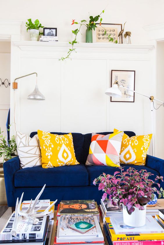 create a contrasting look with printed and bold pillows and a dark sofa
