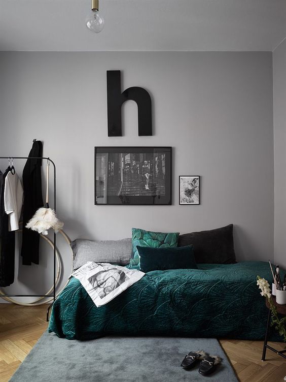 spruce up with grey bedroom with touches of dark green like here - a pillow and a bedspread