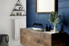 05 matte navy panels on the sink wall brings a bold and masculine feel to this contemporary bathroom