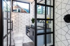 06 There’s a small mudroom with white tiles, a floating vanity and small windows