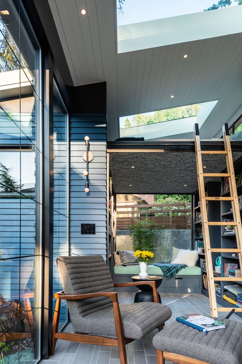 There's a sitting nook for reading by the glazed wall with a skylight above