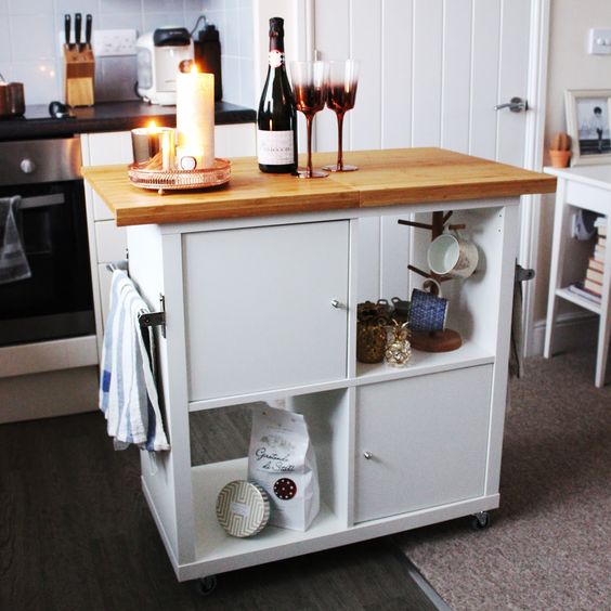 a comfy mobile kitchen island with open and closed storage compartments and a wooden countertop of IKEA items