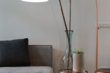 07 a copper floor lamp with a long leg is sure to make a stylish statement and add a trendy touch with its metallic look