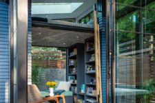 08 The cabin opens to a wooden deck with sliding glass doors and is strongly connected to outdoors