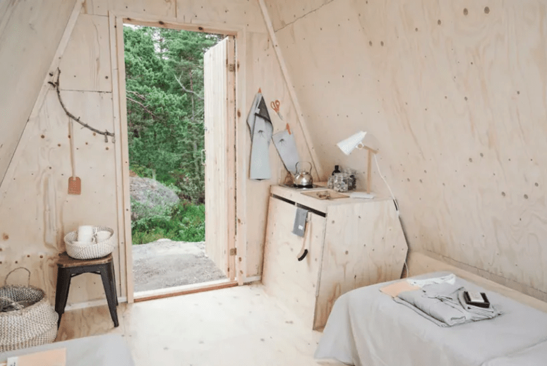The storage is done with a large plywood chest and a large basket, there's also a stool